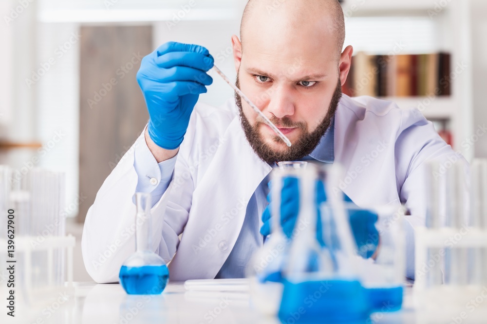 Man researcher carrying out scientific research. Man researcher carrying out scientific research.