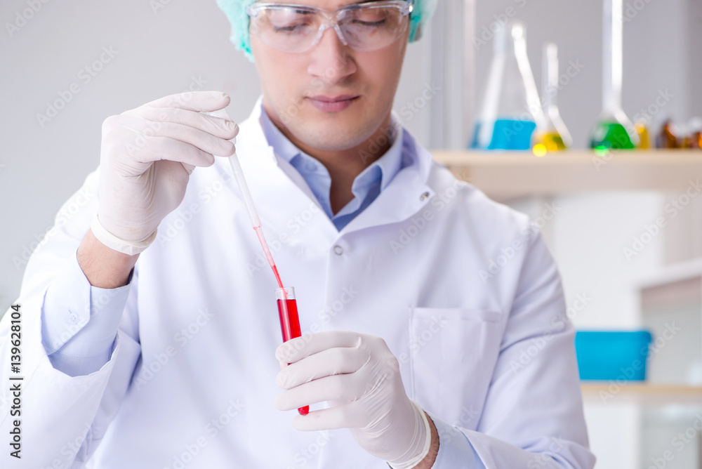 Blood testing in the lab with young scientist Blood testing in the lab with young scientist