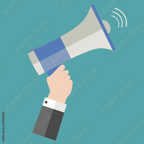 Megaphone in hand on a blue background