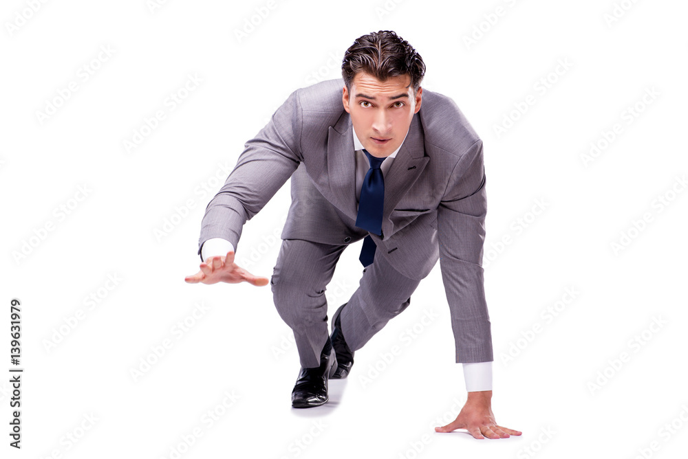 Businessman on start ready for running isolated on white Businessman on start ready for running isolated on white