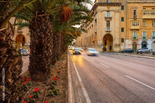 Malta Floriana Triq Sant' Anna / St Anne Street - Traffic - Rush Hour, Valletta Evening summer street streets of green malta traffic car cars architecture building buildings house houses pine plants photo