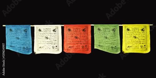 Multicolored Tibetan prayer flags lungta isolated on black background. Red, green, white, blue and yellow flags. A horse of wind in the center.