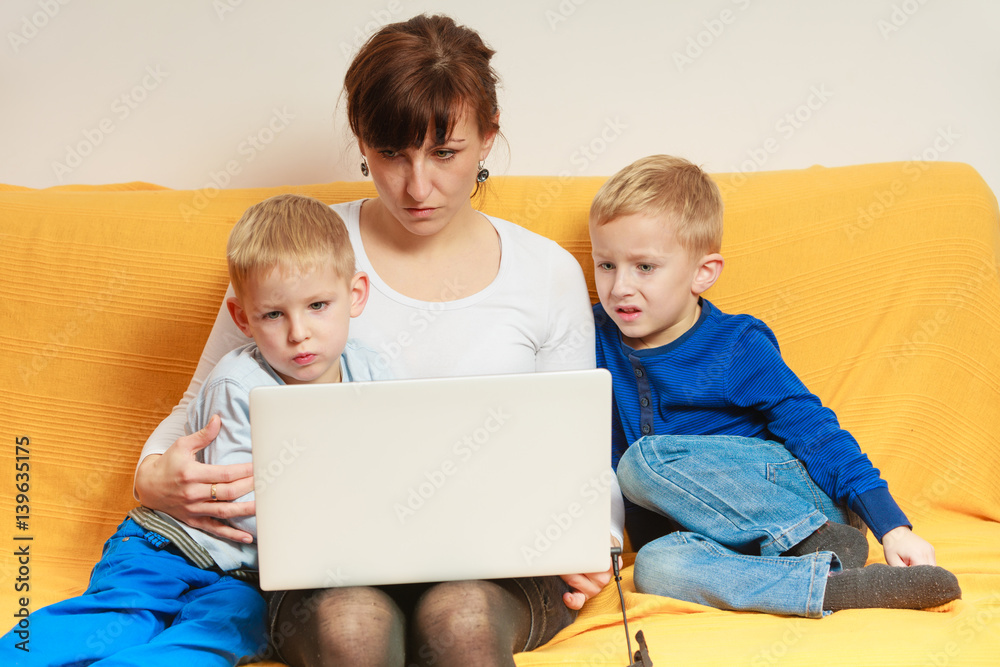 Two little boys and mother using laptop Two little boys and mother using laptop