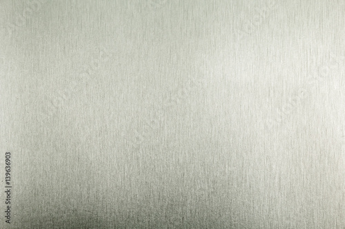 Stainless steel metal surface background or aluminum brushed silver texture with reflection. © Wasan