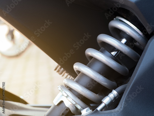 Shock absorber. Close up of a shock absorber in motorcycle racing. Selective focus.