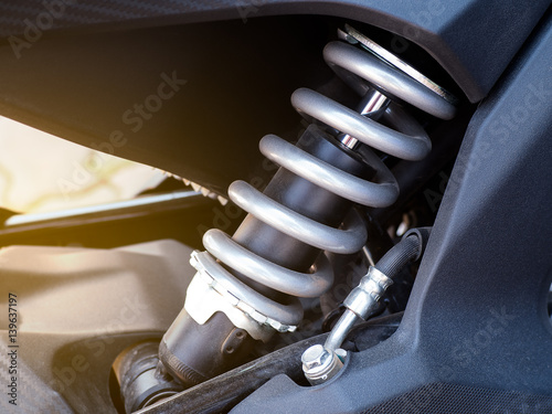 Shock absorber. Close up of a shock absorber in motorcycle racing. Selective focus.