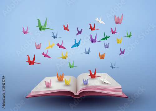 Origami Cranes Flying from Open Book