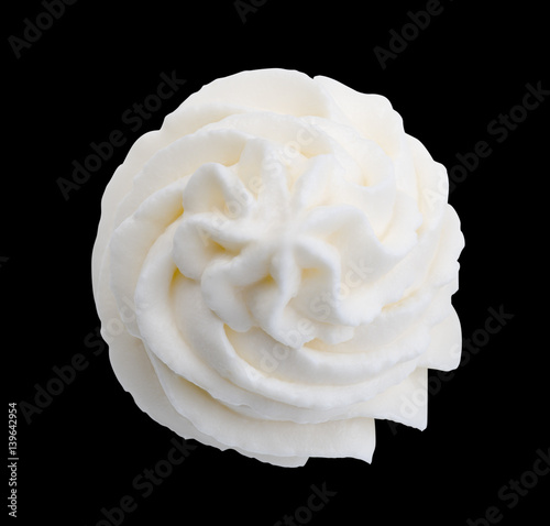 Whipped cream isolated on black background with clipping path. Top view.