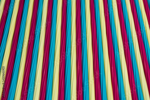 Texture of colorful straight lines by plastic tubes.