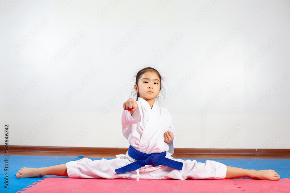 Children during training in karate. Fighting position Children during training in karate. Fighting position