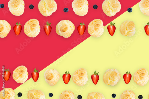 background pattern  seamless pattern  dessert background pattern   Choux Cream with fresh blueberry and strawberry decorated on colorful background pattern.