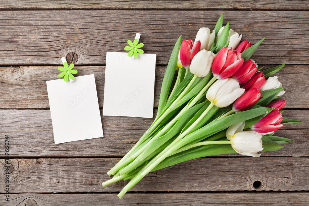 Fresh tulip flowers bouquet and photo frames Fresh tulip flowers bouquet and photo frames