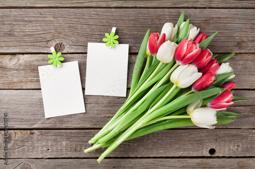 Fresh tulip flowers bouquet and photo frames