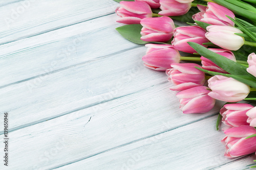 Fototapeta Naklejka Na Ścianę i Meble -  Colorful tulips over wooden background