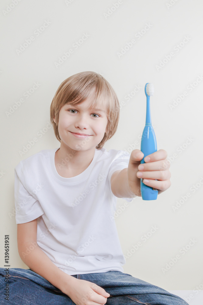 Kid exhibits his electric toothbrush Kid exhibits his electric toothbrush