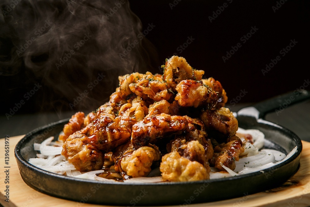 dak ddong jip tuigim is korean fried Chicken gizzard Stock Photo