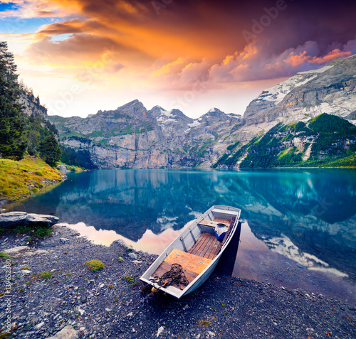 Colorful summer morning on unique lake - Oeschinen (Oeschinensee) photo