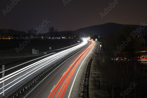 Highway by night with car lights trails, Slovakia