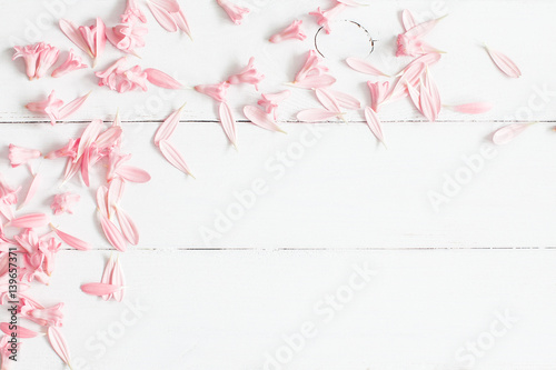 Flowers composition. Pink flowers on white wooden background. Flat lay, top view