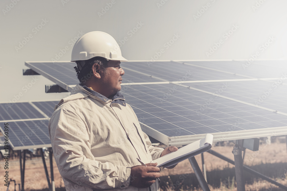 foreman checking job routine of labor working on cleaning solar panel at outside ; operation working on preventive and maintenance in solar power plant for great efficiency foreman checking job routine of labor working on cleaning solar panel at outside ; operation working on preventive and maintenance in solar power plant for great efficiency