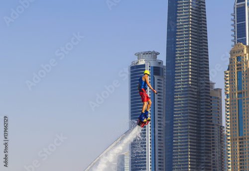 Photography Extreme sportsman on flayborde climbs to perform tricks in the competitions in e