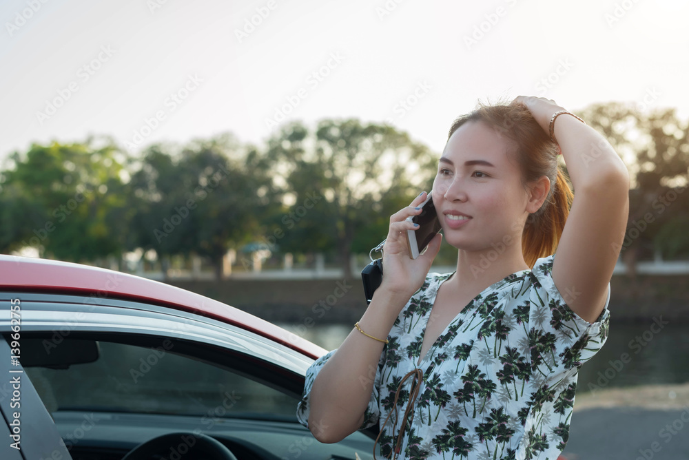 young woman playing mobile on the road young woman playing mobile on the road