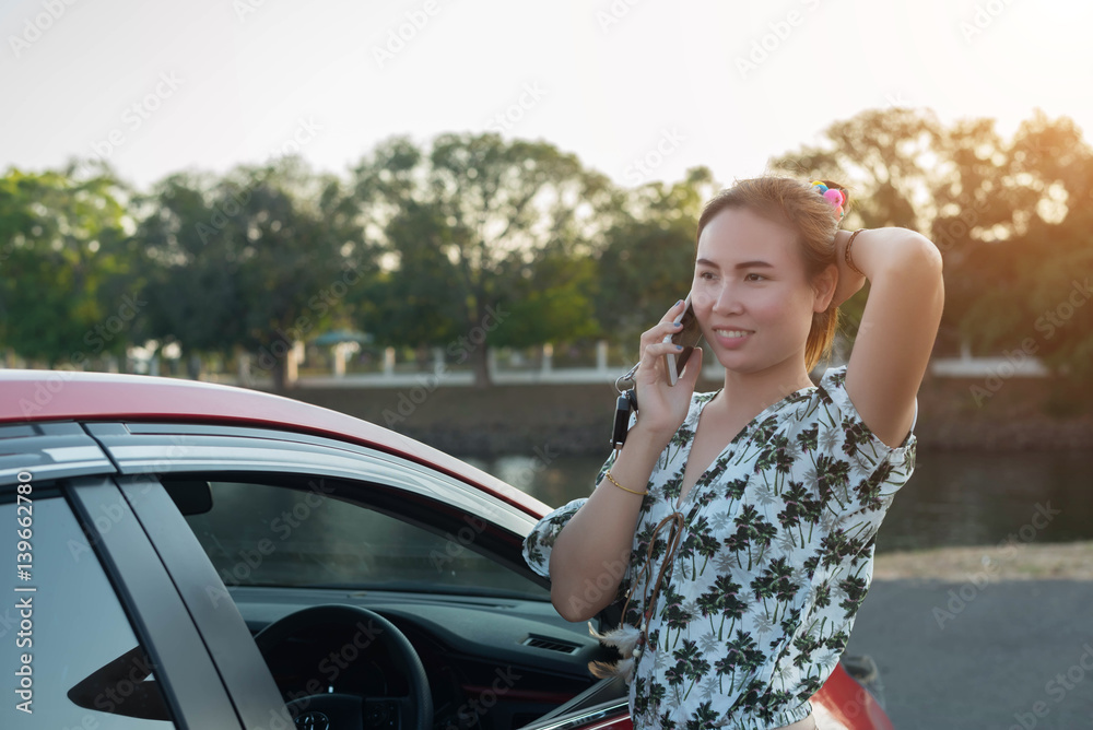 young woman playing mobile on the road young woman playing mobile on the road