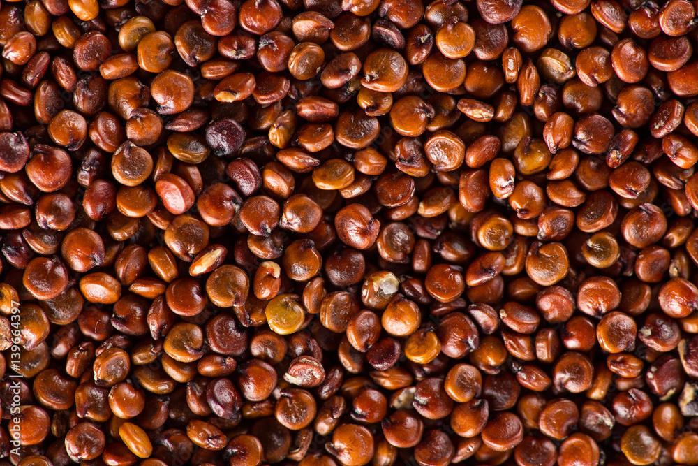 Red quinoa seeds on white wooden table. Red quinoa seeds on white wooden table.