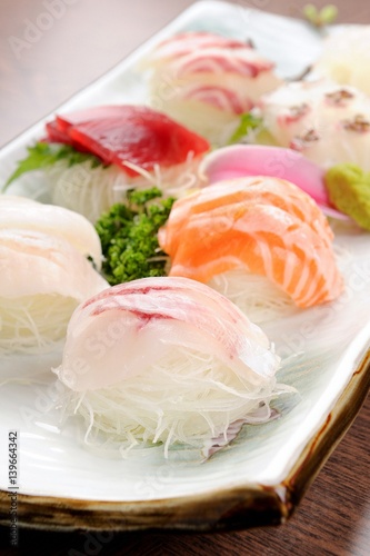 assorted sliced raw fish.