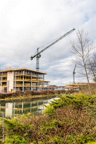 Construction crane at building site on Nene river, Northampton