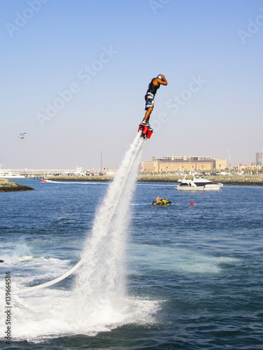Photography Extreme sportsman on flayborde climbs to perform tricks in the competitions in e