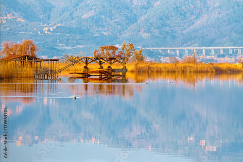 Old fishing pier on lake Massaciuccoli (Torre del Lago Puccini,