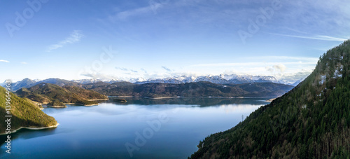 Aerial Panorama of an alpine lake with mountains