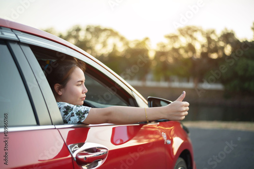 young woman happy in car