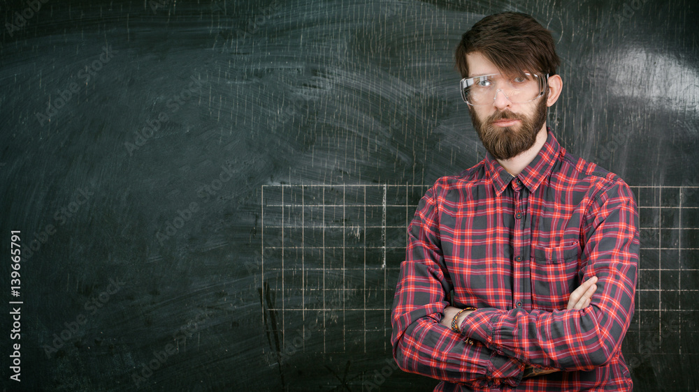 man standing chalkboard