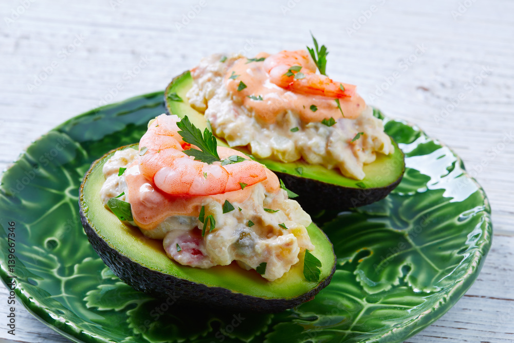Seafood filled avocado with shrimps tapas pinchos