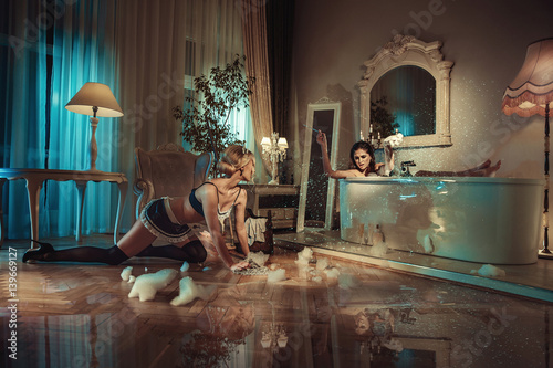 Billede på lærred Conceptual picture of customer yelling on a sensual maid