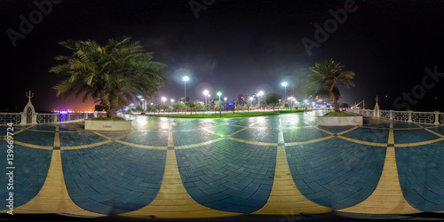 
360 degrees spherical panorama of the abu dhabi (UAE) corniche at night with view of the skyline photo