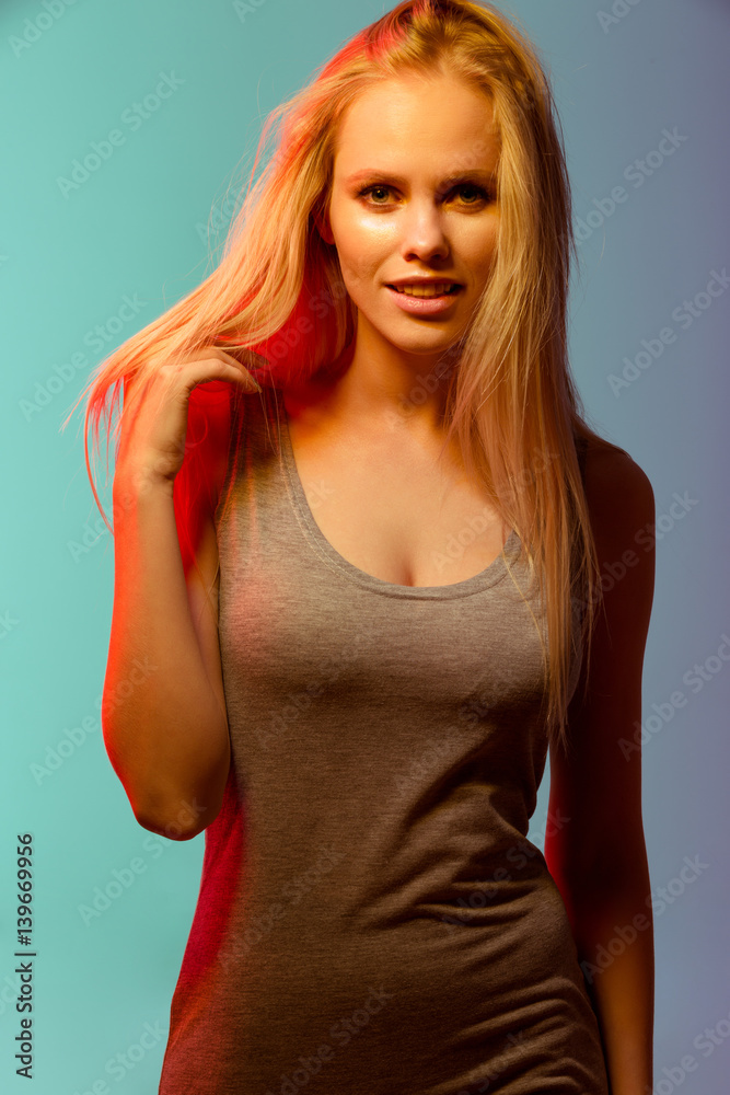 Portrait of smiling beautiful blonde young woman