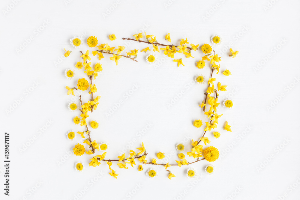 Flowers composition. Frame made of various yellow flowers on white background. Easter, spring, summer concept. Flat lay, top view