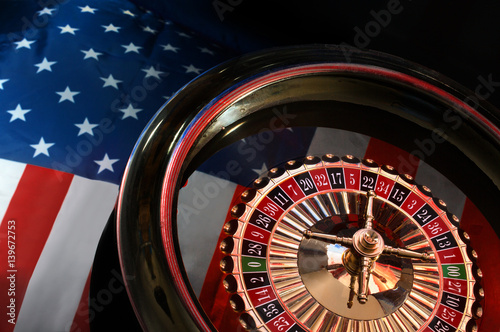 reflection of of the American flag in the roulette wheel