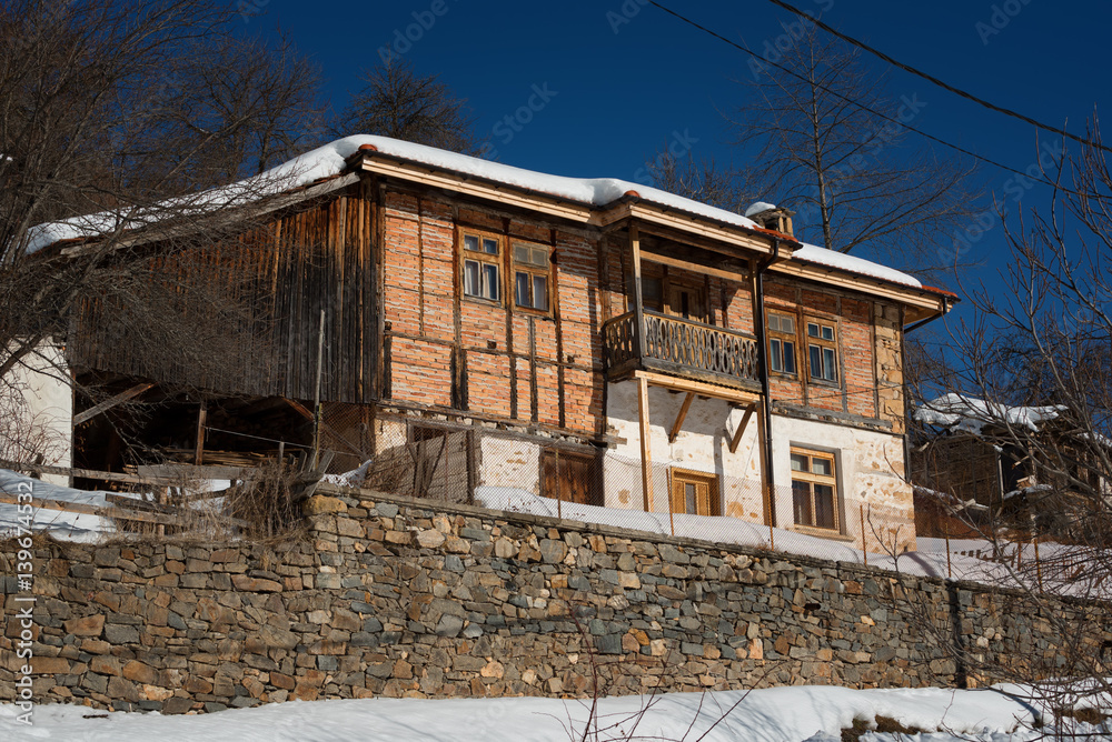 Winter forest scene. Small house at the mountain in a sunny winter day. Snowy fairytale in Bulgaria. Winter forest scene. Small house at the mountain in a sunny winter day. Snowy fairytale in Bulgaria.