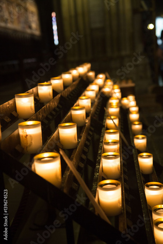 Lighting candles in Church photo
