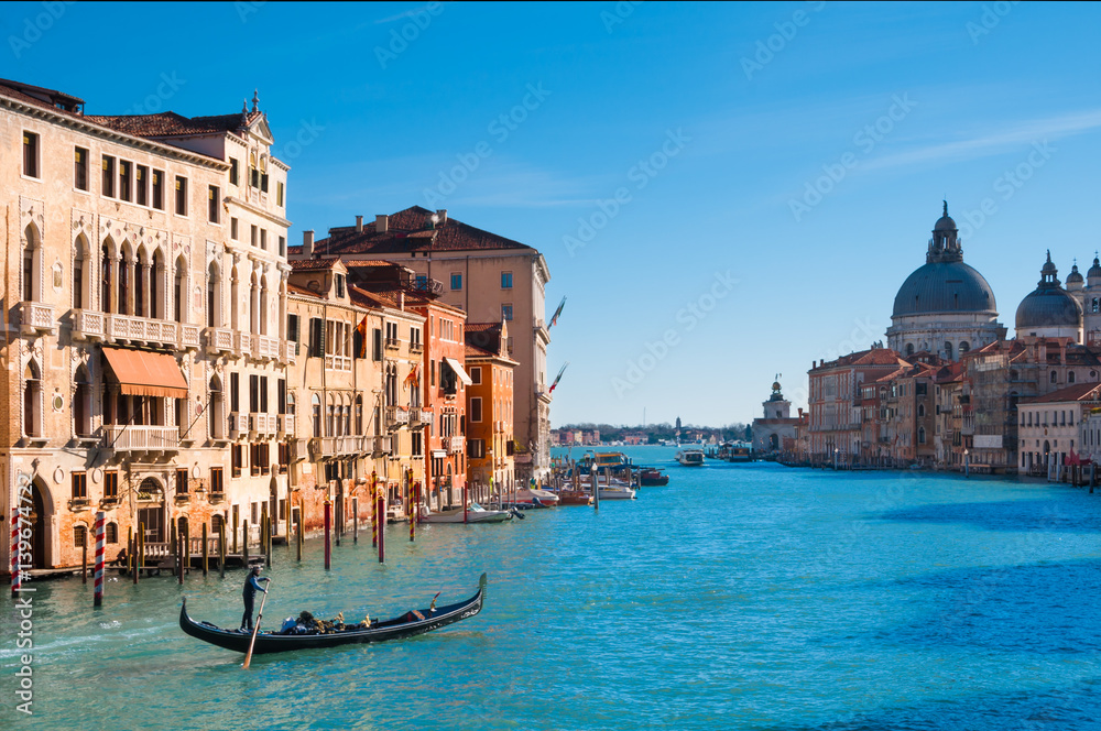 Grand canal in Venice with a gondola passing