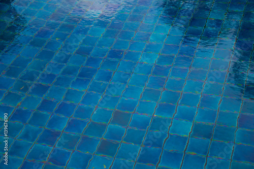 Hotel swimming pool with sunny reflections