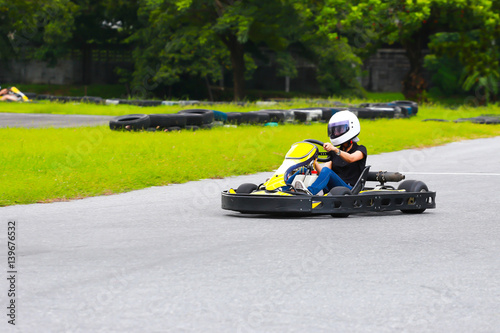 women drive karting car on outdoor track