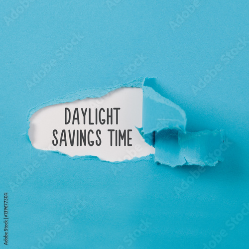 Daylight Saving Time on paper torn ripped opening