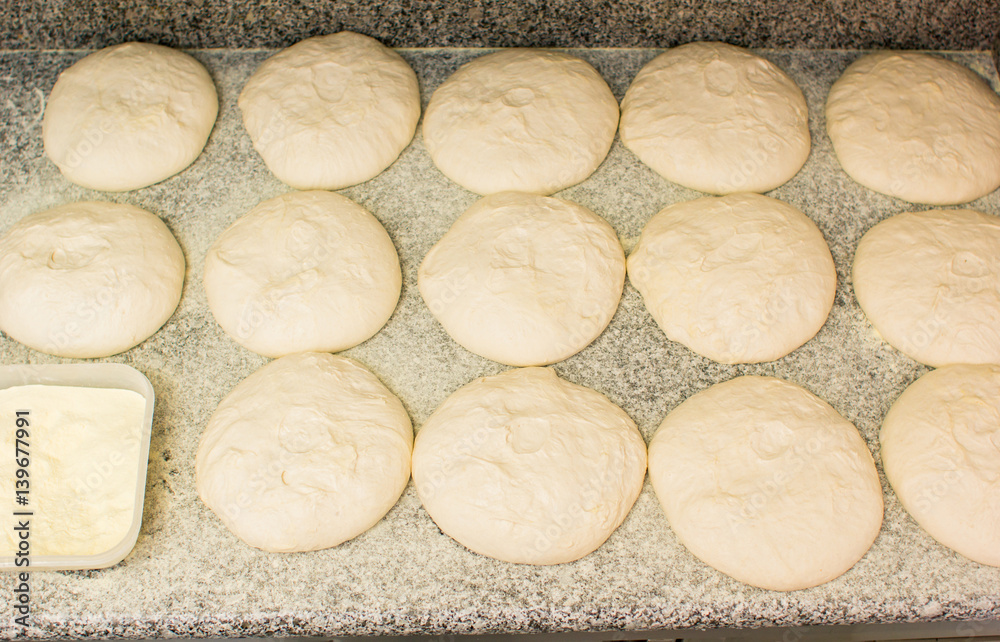 Pizza dough on a table Pizza dough on a table