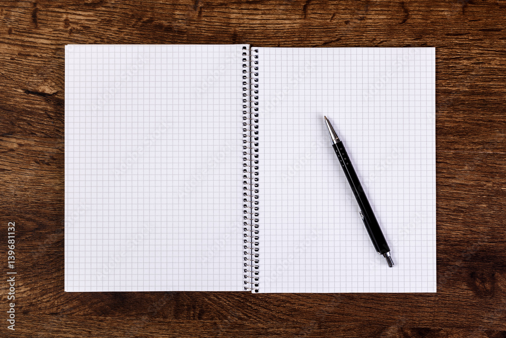 Notepad with pen on the wooden rustic desk. Mockup concept with empty notebook page. Mock-up of blank diary. Wooden rustic desk. Notepad with pen on the wooden rustic desk. Mockup concept with empty notebook page. Mock-up of blank diary. Wooden rustic desk.