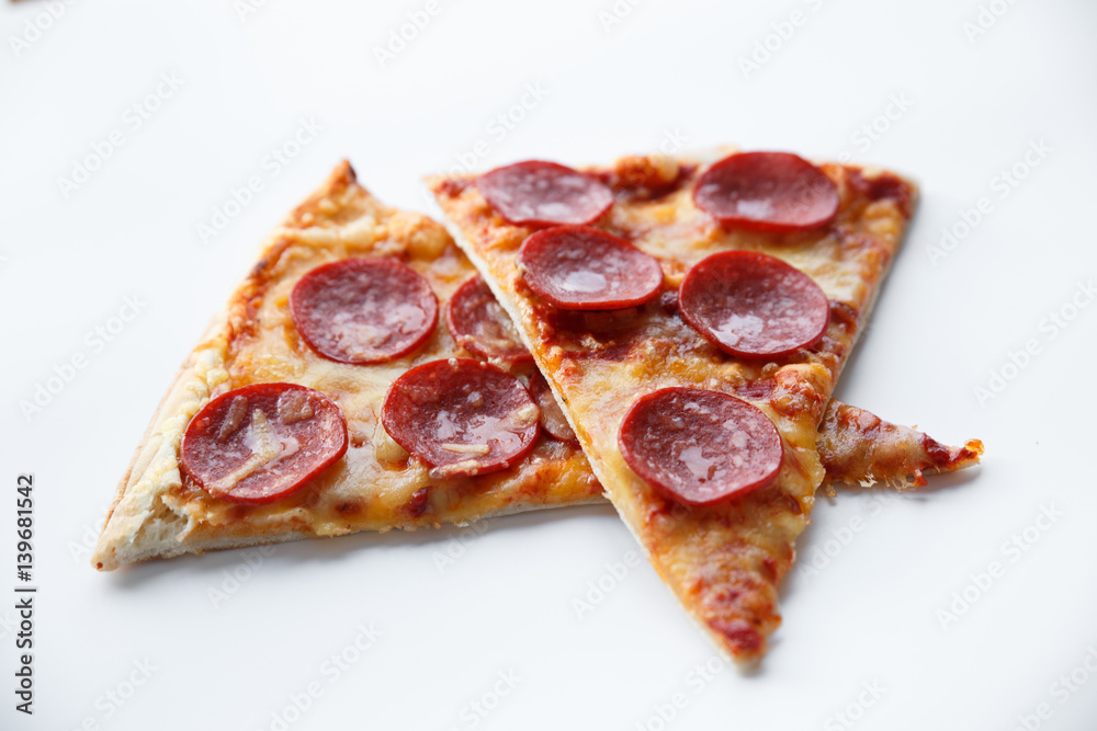 Pepperoni pizza. Hot homemade food. Slices of fresh italian classic salami pizza. Popular topping with cheese. Baked meal. Pepperoni pizza. Hot homemade food. Slices of fresh italian classic salami pizza. Popular topping with cheese. Baked meal.